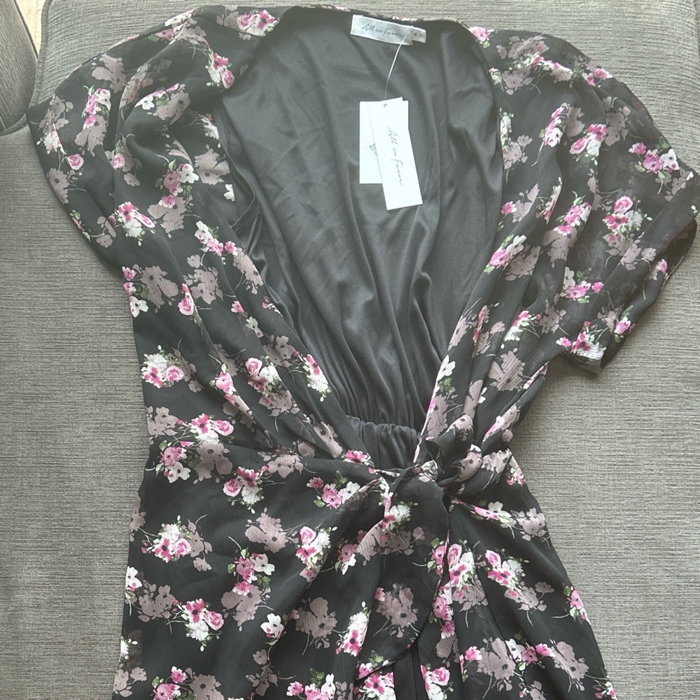 Black and pink floral dress with a tie at the waist